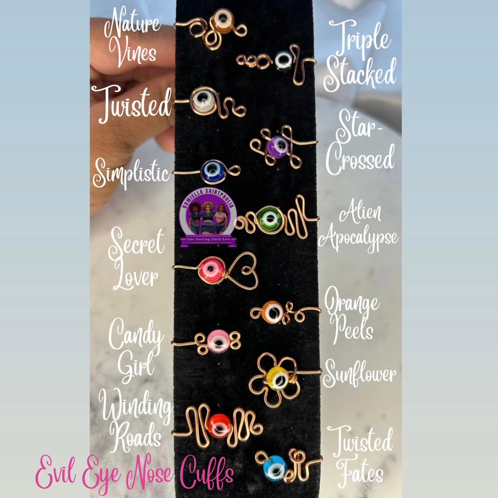Collection of evil eye nose cuffs with various designs and names on a black background.